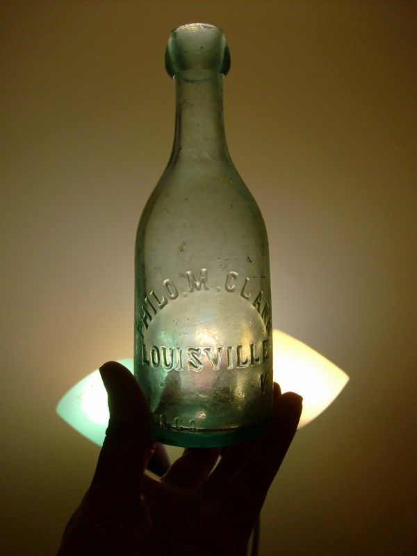 Blob Top Squat Soda Bottle, 1860-63 - The bottle was dug from a cellarhole, and it is marked "PHILO M. CLARK / LOUISVILLE KY."