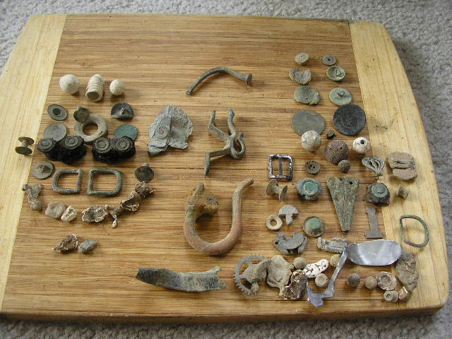 Civil War/Colonial Digs - March 2010-Suffolk/Isle of Wight County---Artillery Sword Scabbard tip, 

Silver spoon, flat buttons, musketballs, Kepi Buck