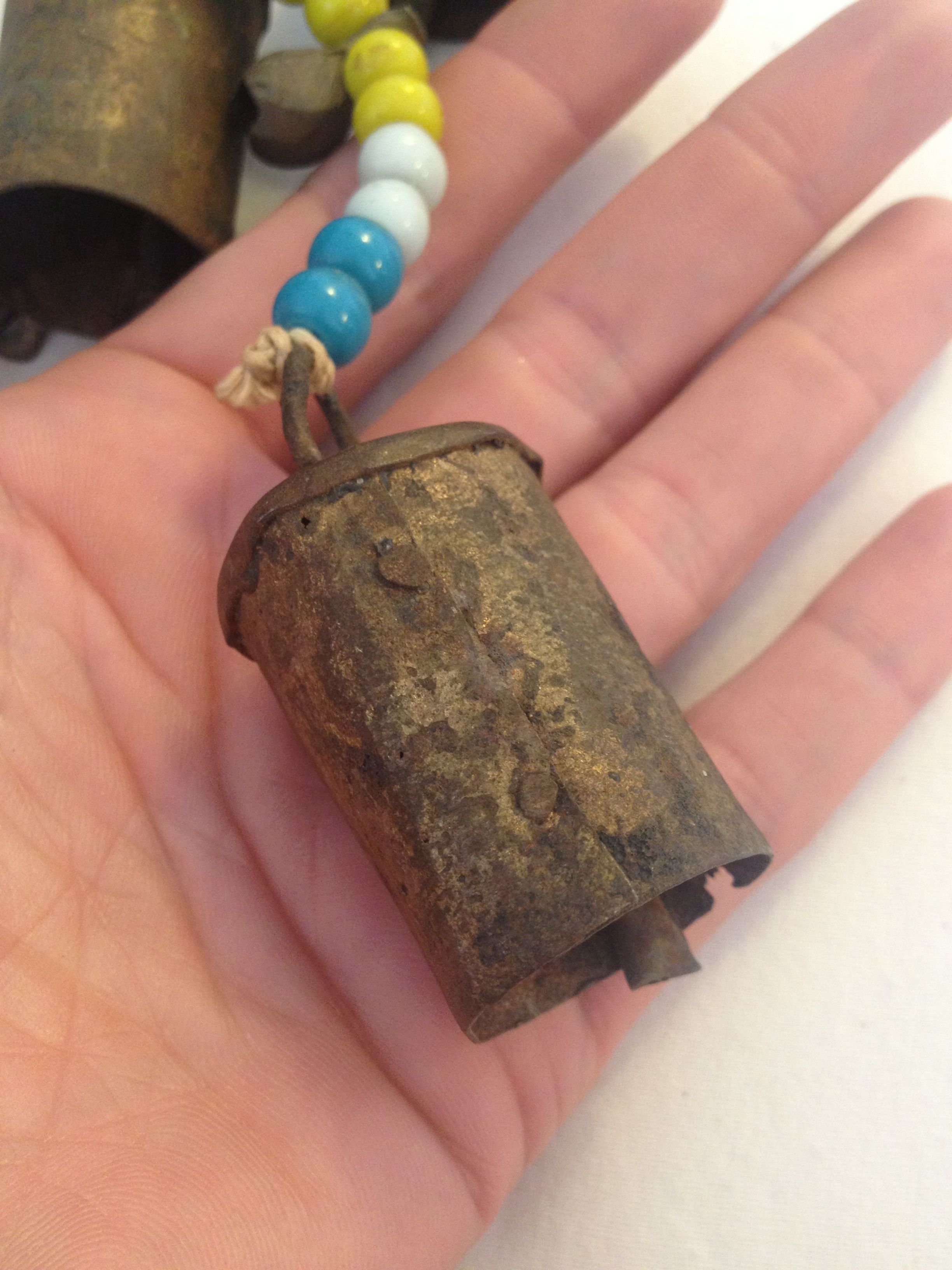 Copper/Bronze primitive bells & glass trade beads presumably Chinese in origin