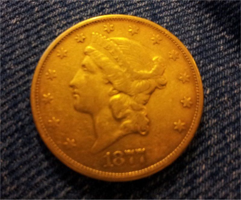 Double Eagle $20.00 Gold Piece. Was found in a old farm house in Missouri that belongs to my family. The coin was found among books.