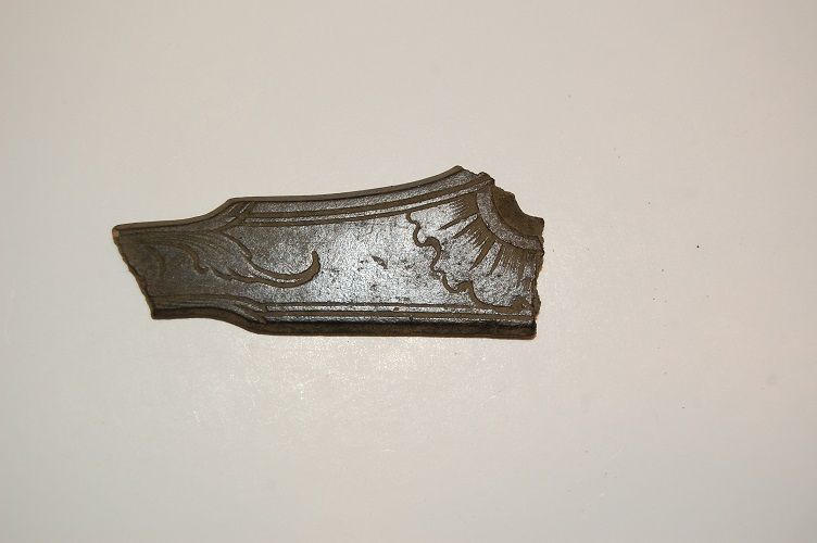 DSC 0011
Broken side plate from a musket or pistol. Copper alloy 1700's