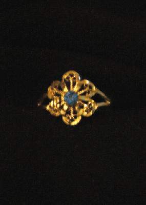flower ring with blue stone