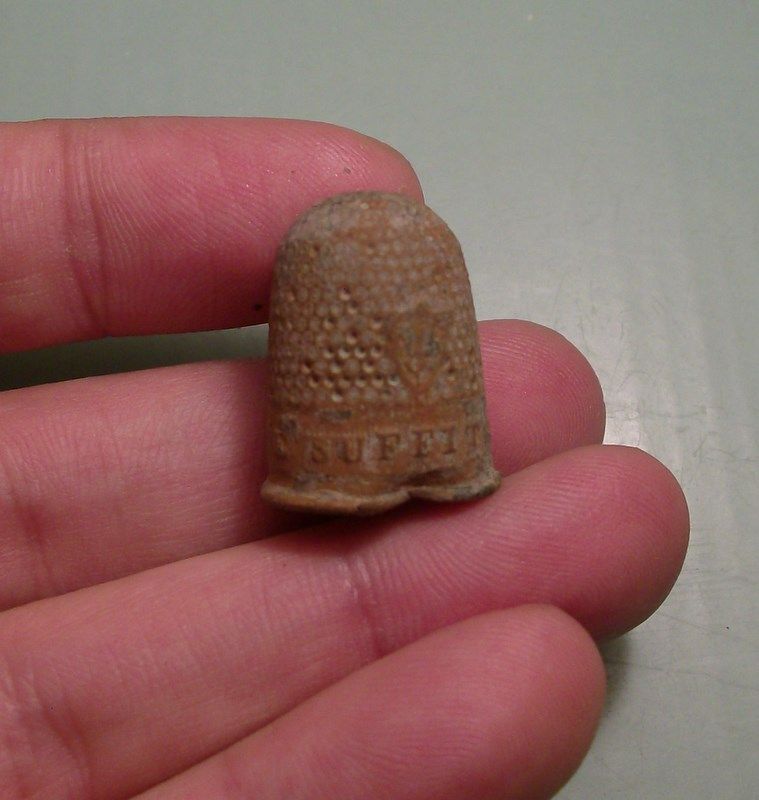 French thimble with the inscription "Un Seul Me Suffit" which means "Only One Is Enough."