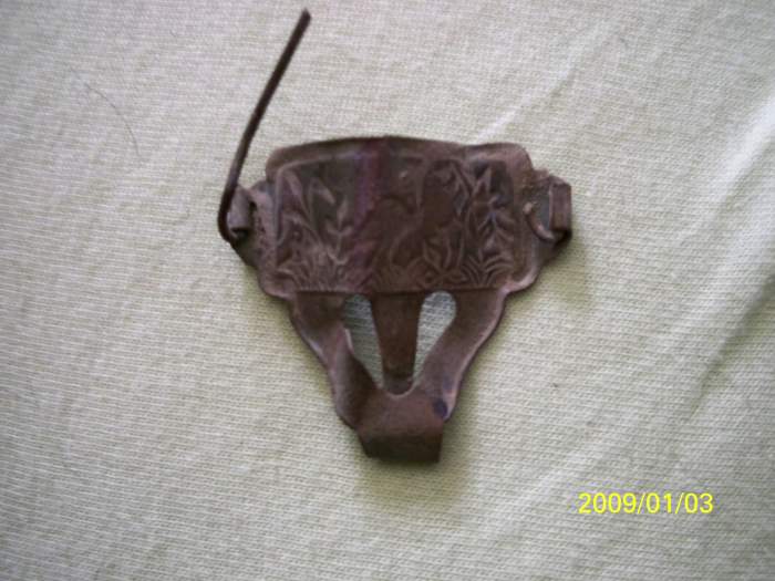 i think this is a decorative suspender clip