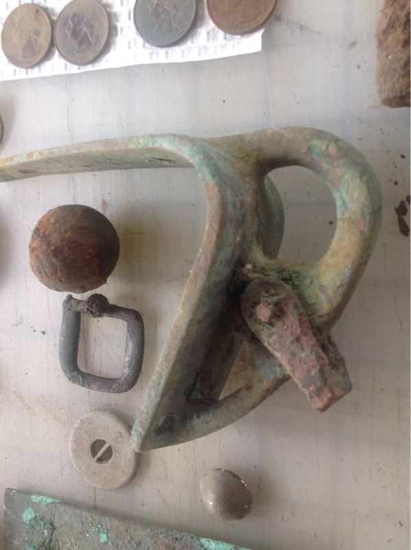 image 1472971450

Goes on the Bow of a small sailboat.
Grapeshot or Shotput ball?
Buckle