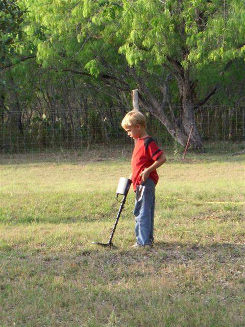 my little guy - barefoot and holding up his britches with the other hand..can you say country hick?