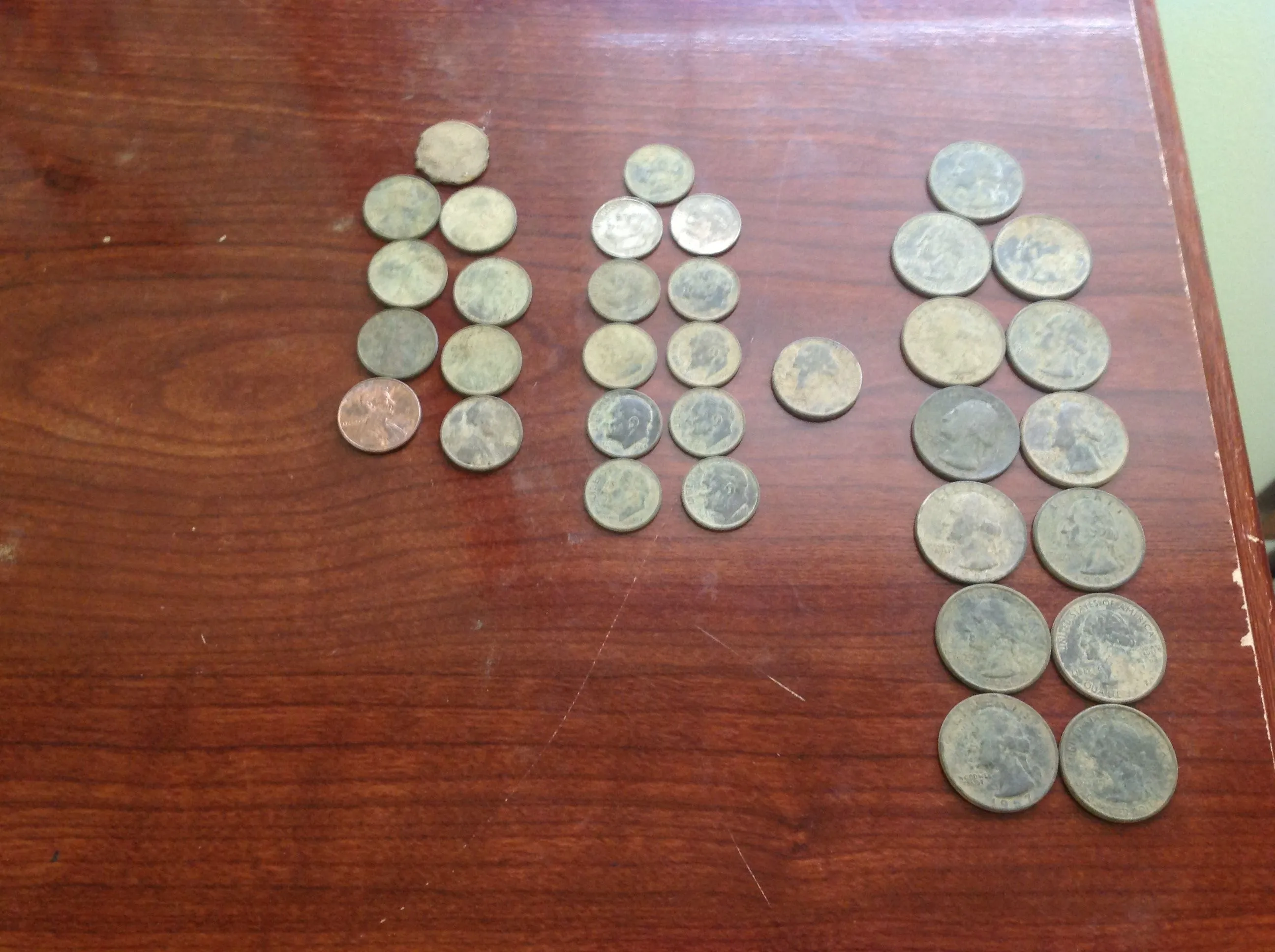 My second day with the Garrett Ace 350 13 quarters, 11 dimes, 1 nickel, 9 pennies no silver but I did get a wheat cent