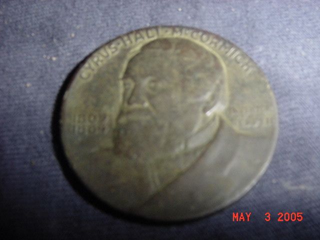 Obverse of 1931 Token from the International Harvester Company celebrating the centennial of the McCormick Reaper