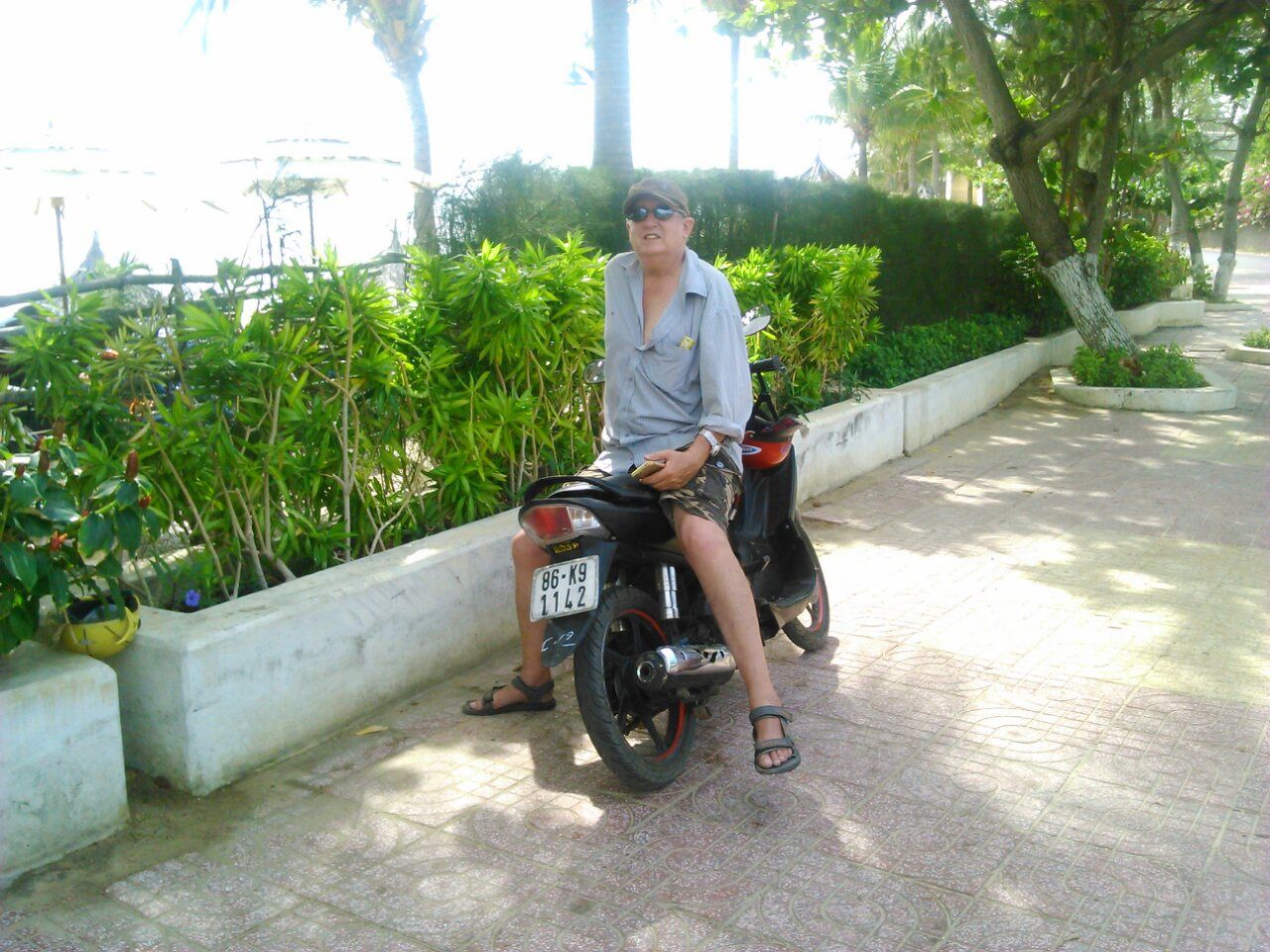 relaxing on my motorbike near the beach