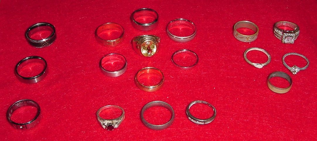 RINGS FROM JAMAICA TRIP - FOUND 20 - 18 SHOWN 
(1 RETURNED - 1 STOLEN THAT ARE MISSING FROM PIC)