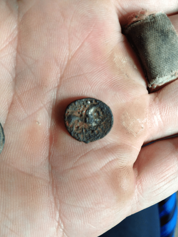 Silver Celtic coin covered in iron, iceni horse and boar