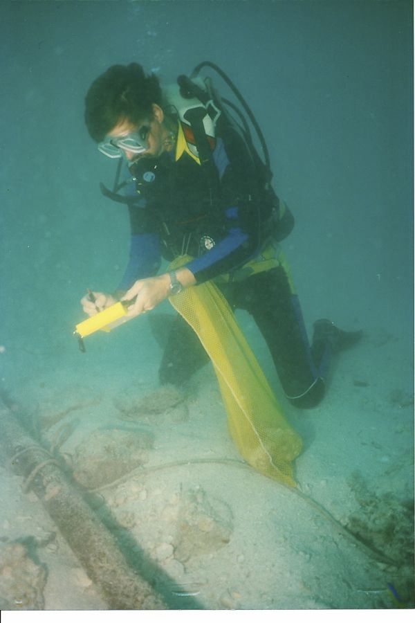 Syd Jones, near the Atocha main pile with some ballast stones scattered about.  The main pile, relocated as they searched in and under the ballast for