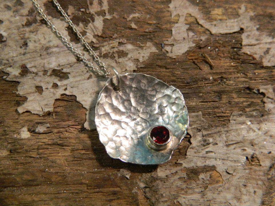Textured sterling silver and garnet pendant
