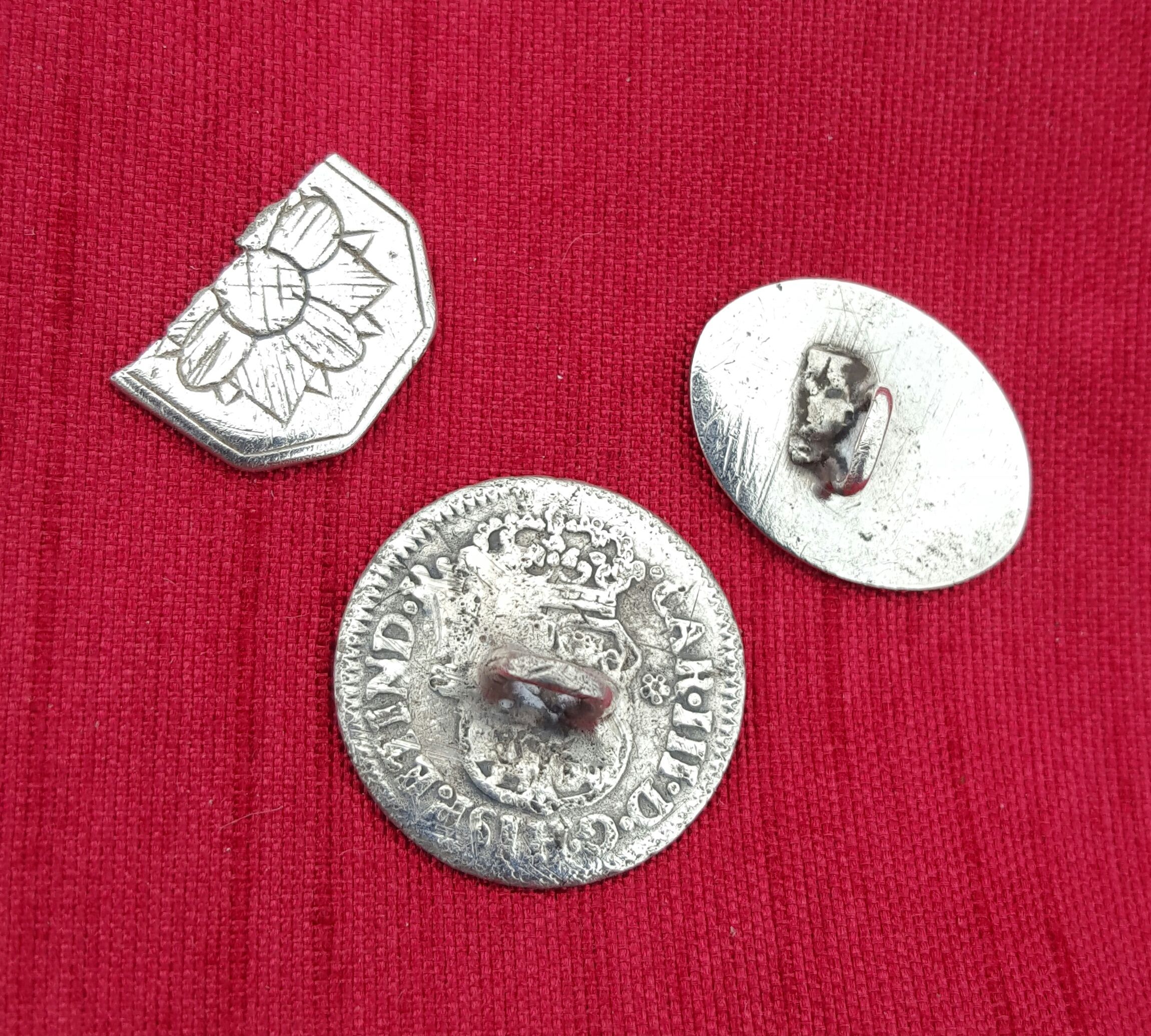 Three silver cufflinks found at a colonial home site