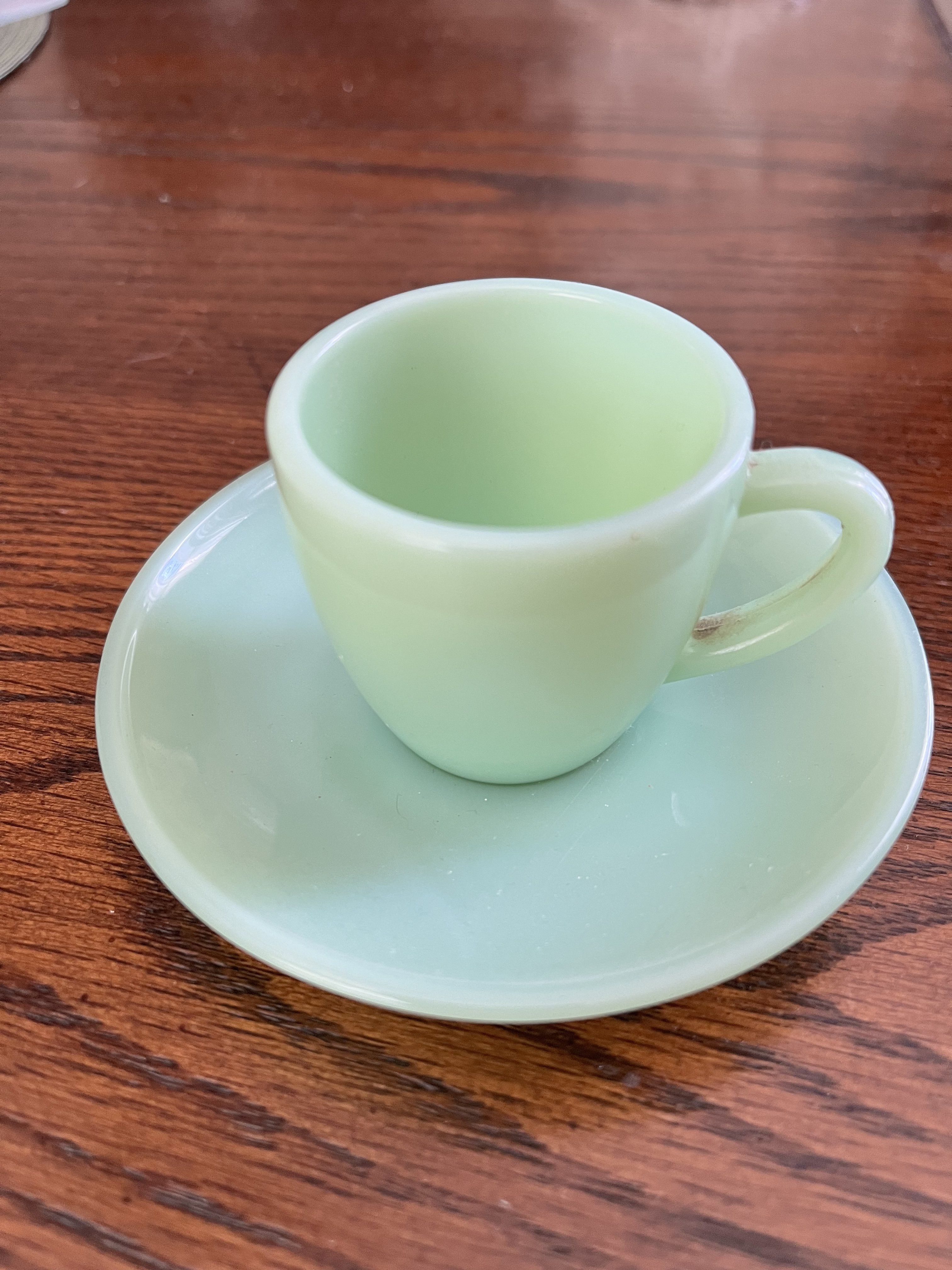 Tiny cup saucer