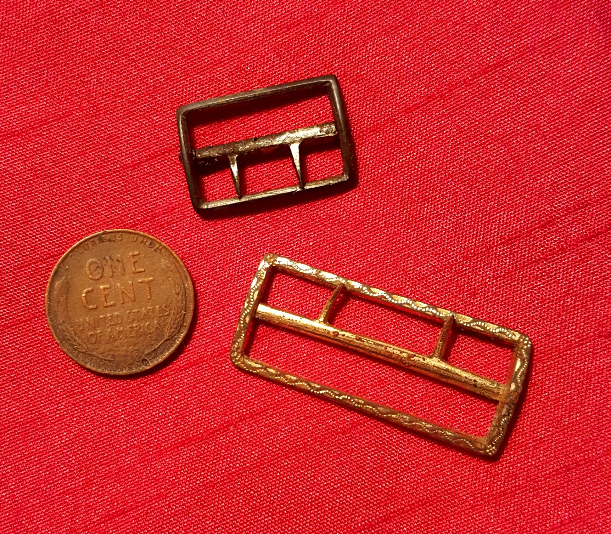 Two small brass buckles; probably used on clothing