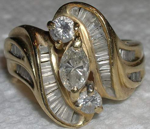 Woman's Diamond Ring - Woman's 14k diamond ring. It has a total of 47 diamonds!